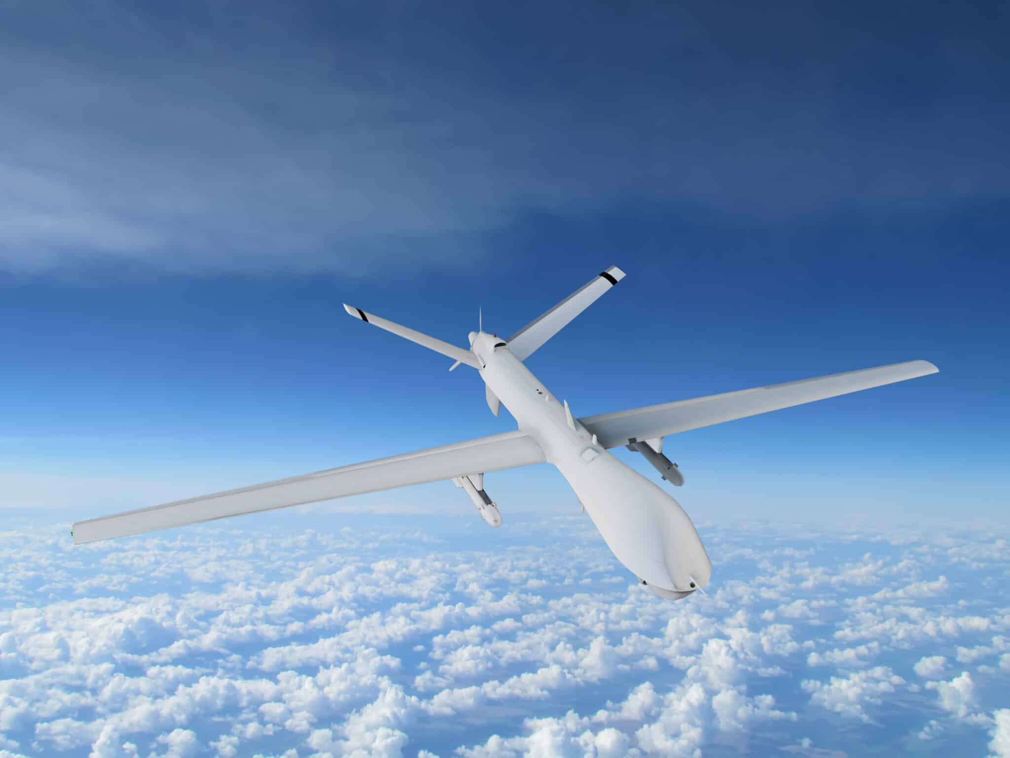 Military,Uav,Airplane,Flies,Against,Backdrop,Of,Beautiful,Clouds,On
